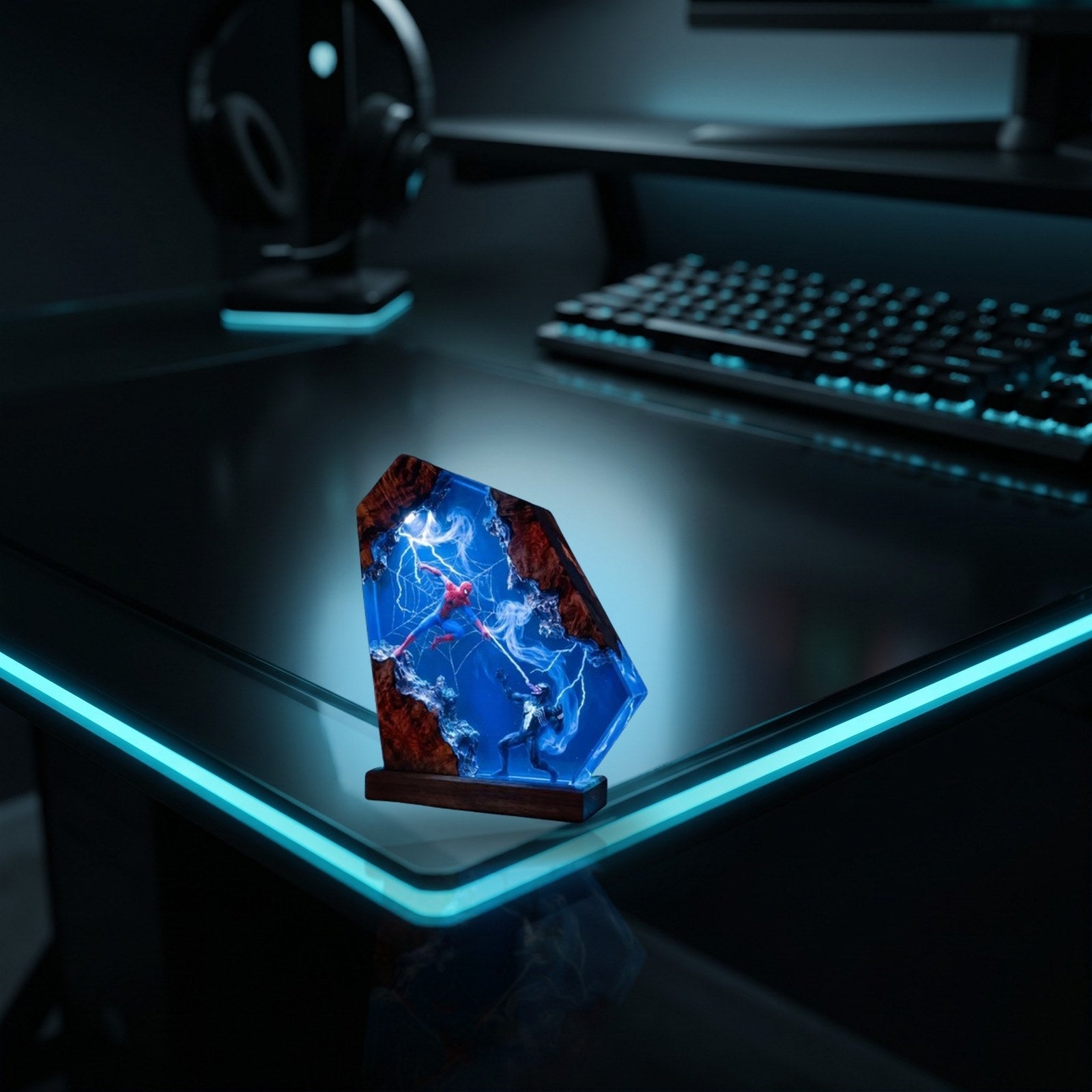 Resylume Portal Duel resin lamp on a gaming desk with cyan lighting